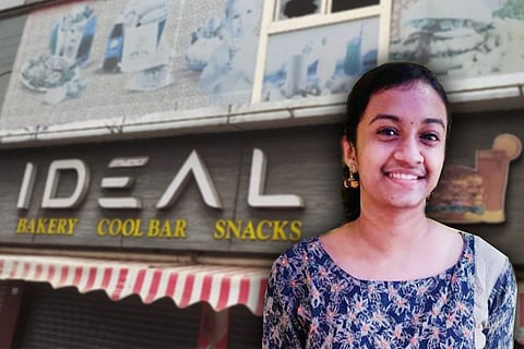 Devananda against the backdrop of the food outlet