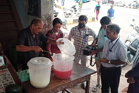 Officials inspecting food in a shop