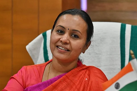 Kerala Health Minister Veena George sitting on her desk