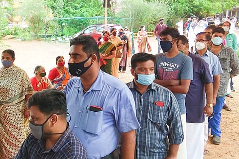 People voting in front of polling booth in Kerala