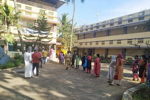 Voters queued up to cast their vote at a school