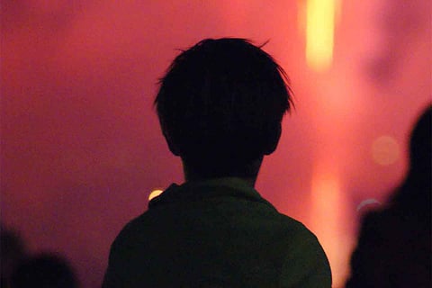 Silhouette of a kid facing away