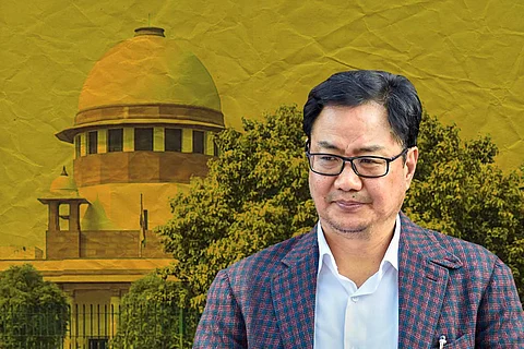 Kiren Rijiju with Supreme Court in the background