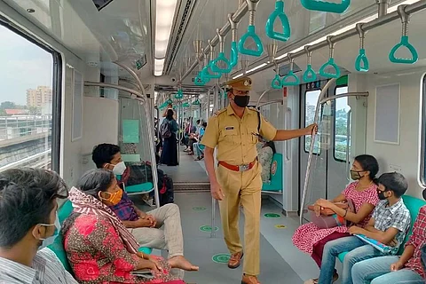 Passengers inside Kochi metro train