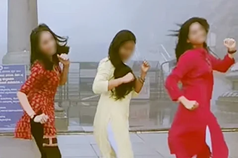 Screengrab from Instagram reel of three girls dancing outside Talacauvery temple