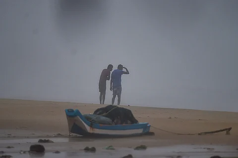 Two men endure the storm as Cyclone Nivar reached Chennai