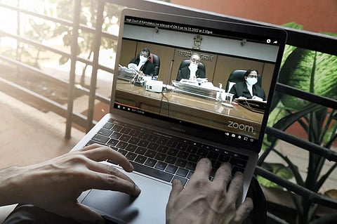 A laptop screen with live proceedings of the Karnataka High Court hearing on hijab issue