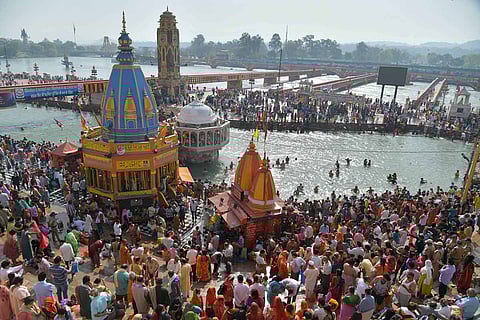 Devotees gather at Har Ki Pauri ghat in Haridwar to offers prayers during Kumbh Mela 2021, amid surge in Covid-19 cases across country