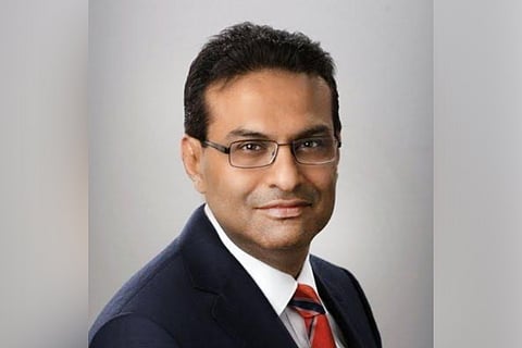 Laxman Narasimhan wearing a suit