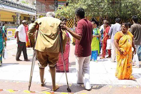 Disabled person on crutches