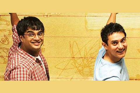 Madhavan seen as Farhan on the left and Aamir as Rancho on the right, from the poster of '3 Idiots' .