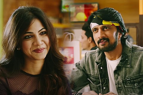 Madonna Sebastian on the left and Kichcha Sudeep on the right.