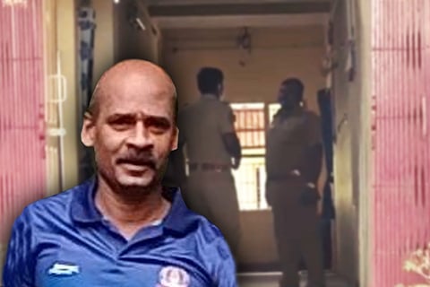 Accused constable in front of a police station