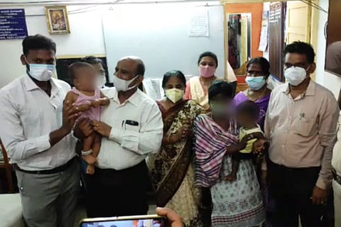 Officials with the rescued babies