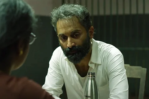 Fahadh Faasil as Suleiman in Malik film wearing a white shirt and sporting grey hair