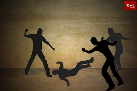 Representative image of a group of men attacking a person.