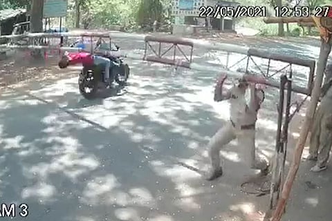 Pillion rider falls off the bike after the bikes evades a checkpost