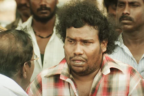 Yogi Babu in red and white checked shirt in Mandela
