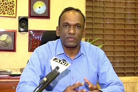 IPS officer Manoj Abraham speaking into a mic
