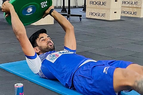 Manpreet Singh works out