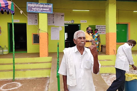 105-year-old Marappa Gounder showing his inked finger after voting in Coimbatore