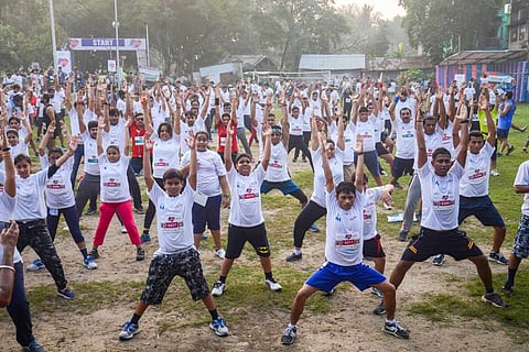 A group of people doing yoga