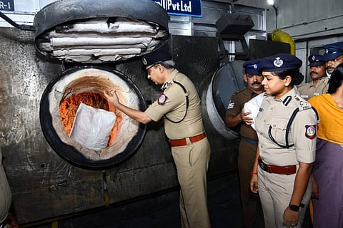 Marijuana being thrown into an incinerator