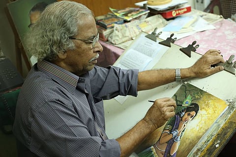 Artist Maruthi doing a water painting
