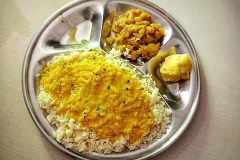 A meal plate with rice and dal