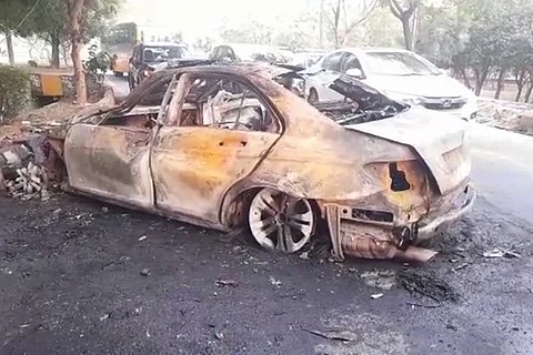 Mercedes car rams divider and catches fire in Noida
