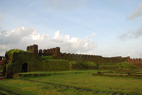 Moss-covered structures at the Mirjan Fort against the blue sky