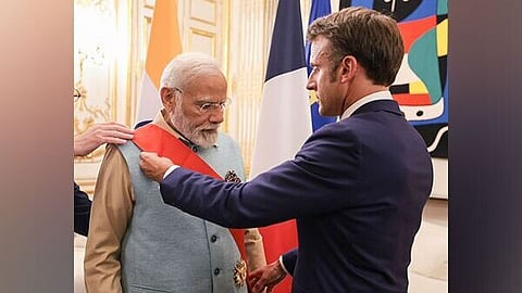 French President Emmanuel Macron conferring Grand Cross of the Legion of Honour to PM Modi
