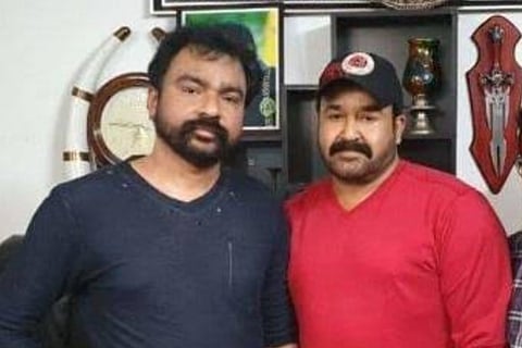 Monson Mavunkal and actor Mohanlal