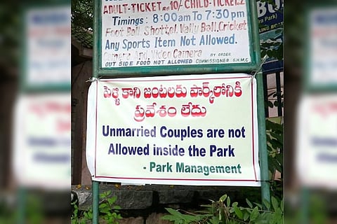 The banner which says that unmarried couple are not allowed inside the park