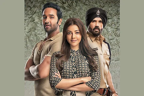 Kajal Agarwal is seen in the center along with Suniel Shetty as cop and Vishnu Manchu on the sides.