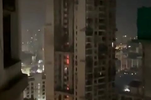 An apartment building on fire in Mumbai