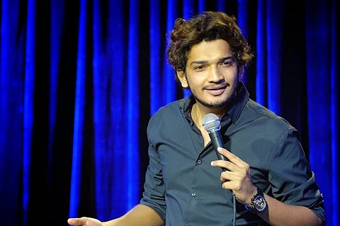 Munawar Faruqui performing inside an auditorium