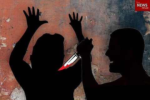 Silhouette of a man attacking a woman with a knife