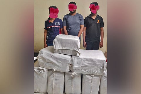 Drug syndicate members with the seized drugs
