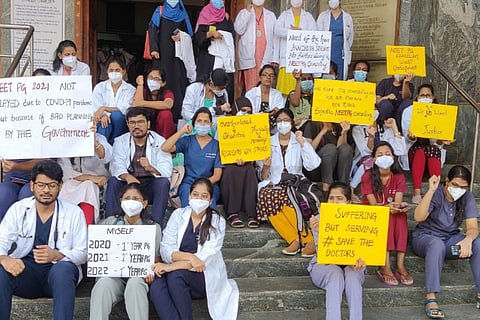 Students holding posters and participating in the protest