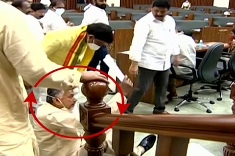Chandrababu Naidu sitting on the floor near the Speakers podium