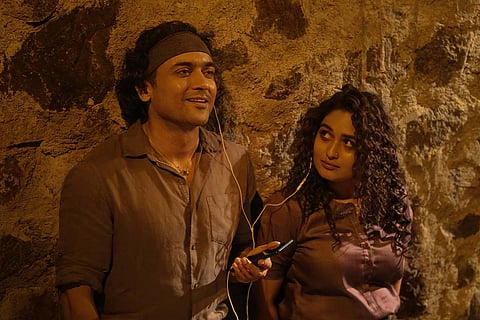 Suriya and Pragya Martin are seen listening to music together in a still from Navarasa