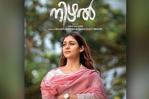 Nayanthara is seen wearing a pink ethnic chudidar in the poster of 'Nizhal'.