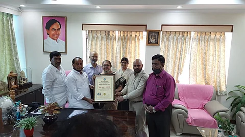 Forest Department officials receiving certification from the ISO