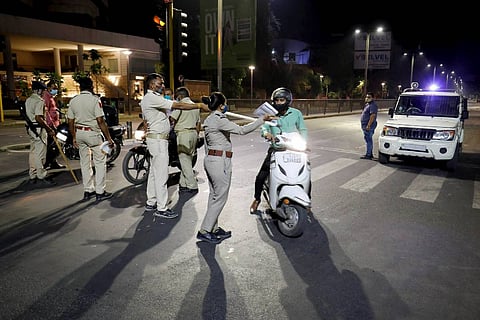 Police personnel stopping people during COVID night curfew: Andhra Pradesh extends night curfew for two more weeks
