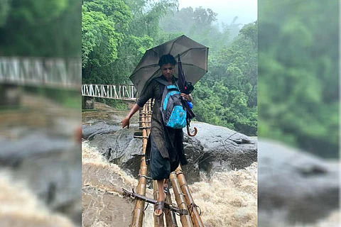 Teacher crossing bridge destroyed in Kerala flood to reach students of tribal colonies