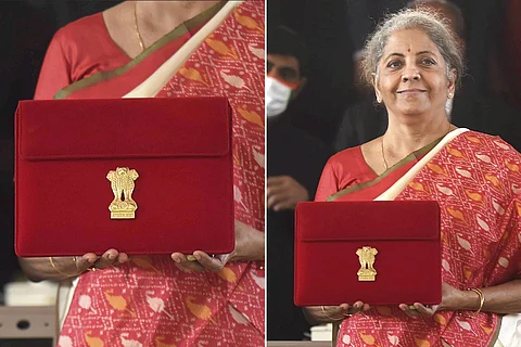 Nirmala Sitharaman holding up tablet of Union Budget 2021
