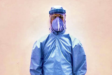A health worker in PPE kit