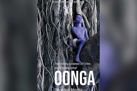Cover page of children's novel Oonga which shows a blue coloured adivasi boy