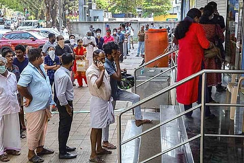 People waiting in line to collect ration